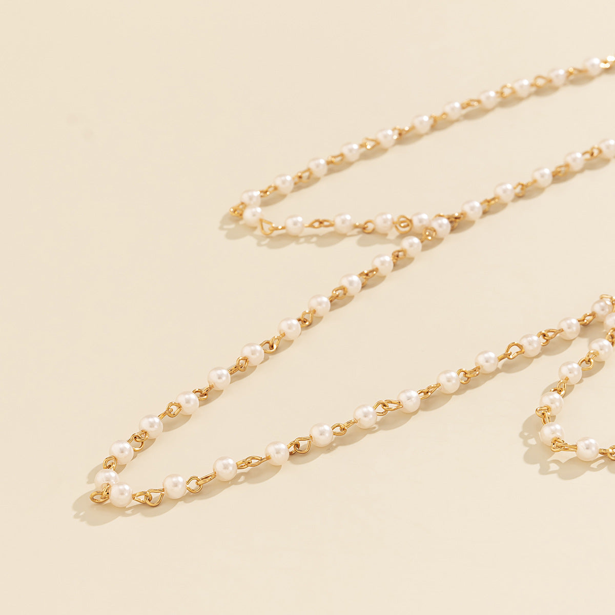 Chaîne de corps femme avec perles imitation et plaquage